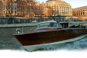 Wodden Boat sailing on the Seine river in Paris
